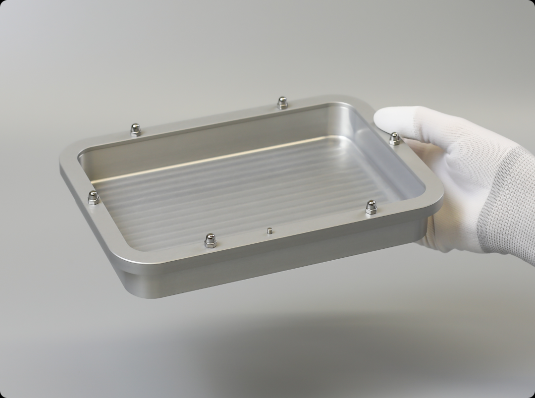 Assembled Lyoprotect Alumium Tray held be gloved hand