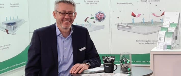 Teclen booth at analytica trade fair in Munich 2024 with managing director Rolf Lenhardt